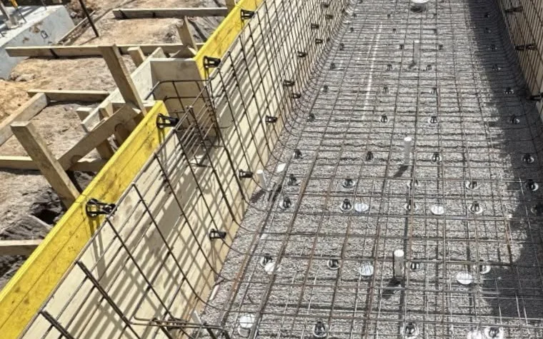 Pool formwork, wall reinforcement and floor steel prepared for the next structural stage in Toorak.